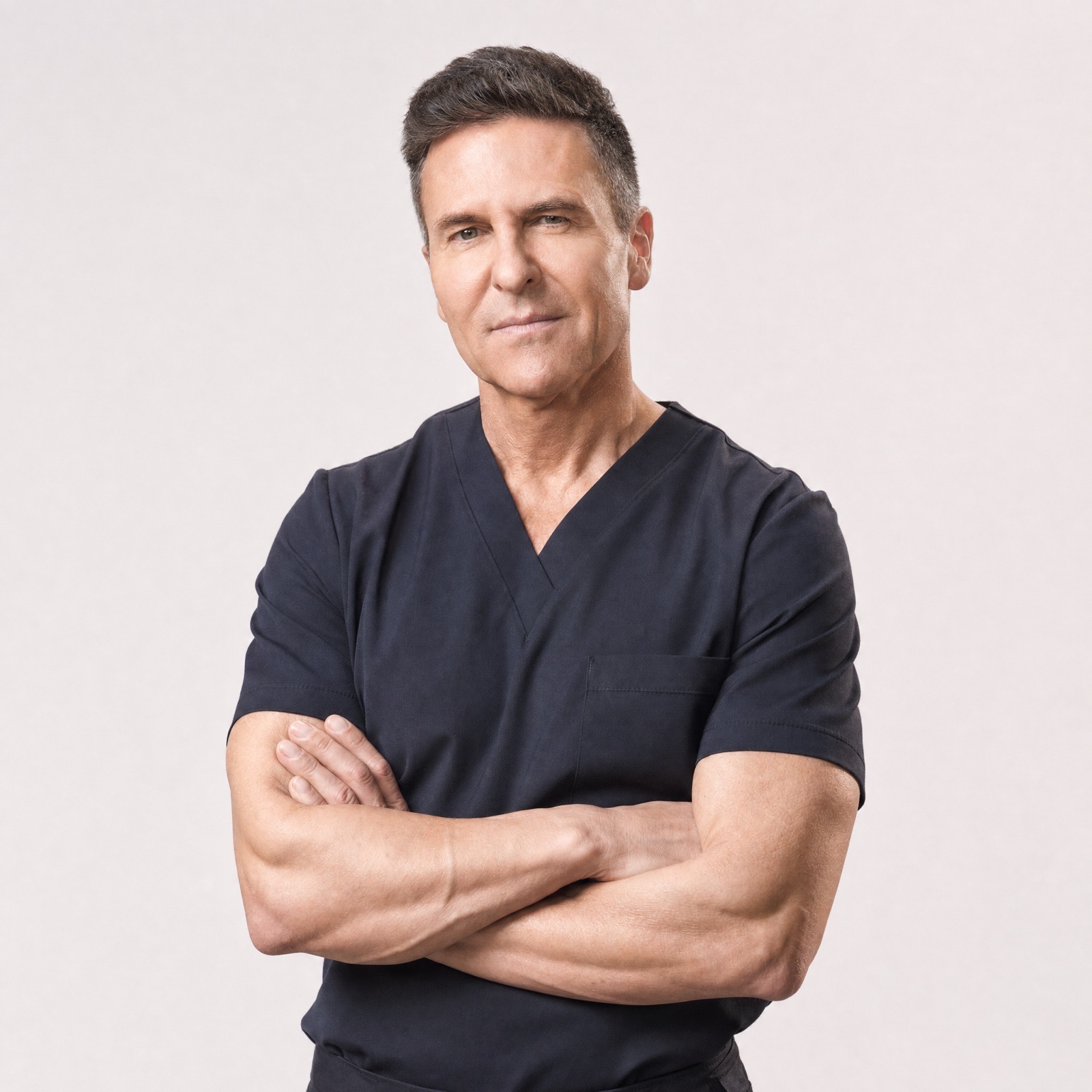 Portrait of Dr. Iván Mañero in navy scrubs
